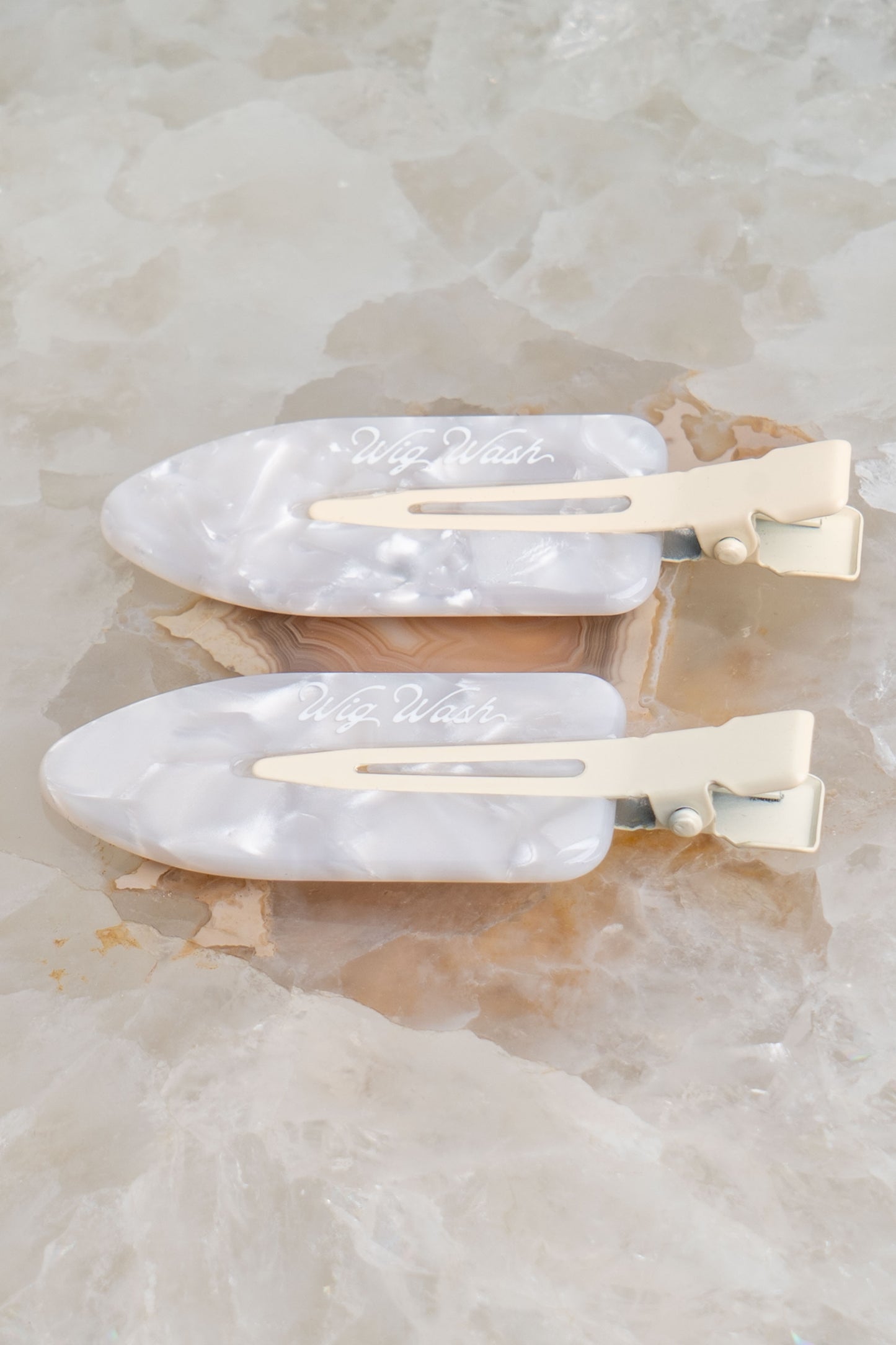 Creaseless hair clips for wigs and extensions by Wig Wash pearl white styling clips