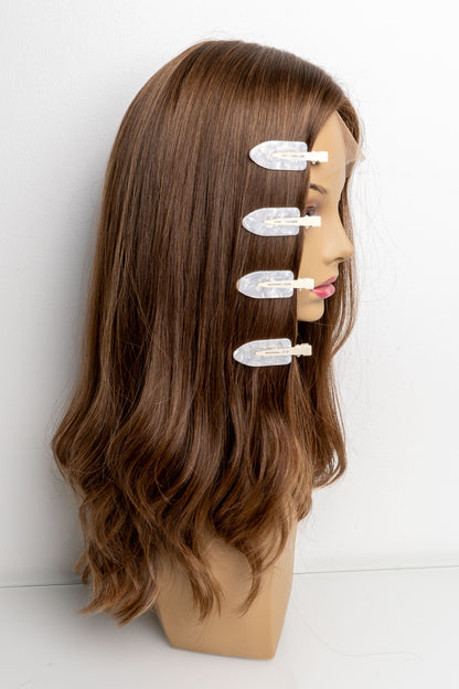 Pearl white creaseless hair clips holding human hair wig in place during styling