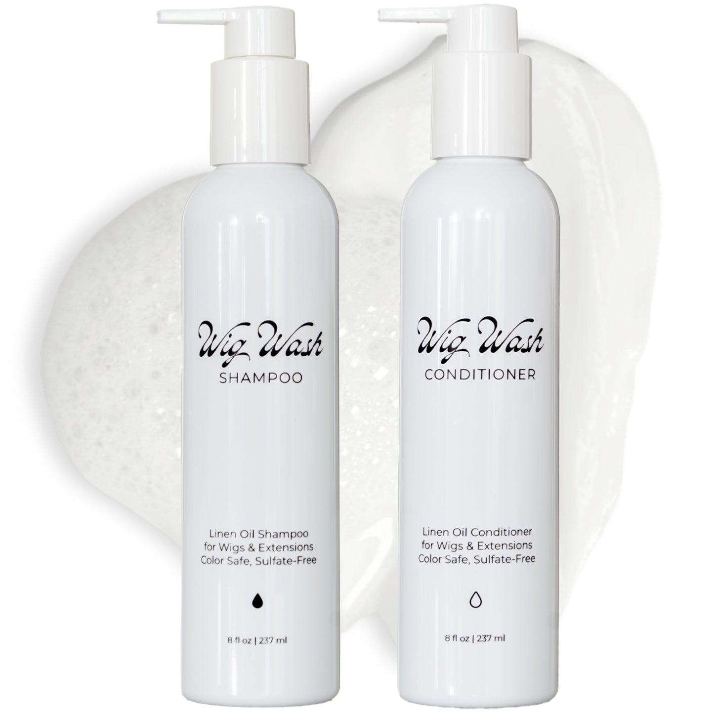 Two white pump bottles of Wig Wash hair care products, labeled 'Wig Wash Shampoo' and 'Wig Wash Conditioner,' shown on a clean white background with a soft white liquid smear behind them.